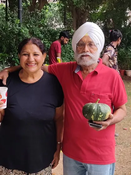 Two happy customers posing with their purchases, a testament to the market's positive vibe.