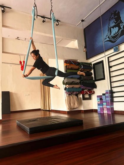 Finding moments of stillness in the air is a practice in itself. This pose is not just about holding on, but about engaging the core to create a stable, graceful line.