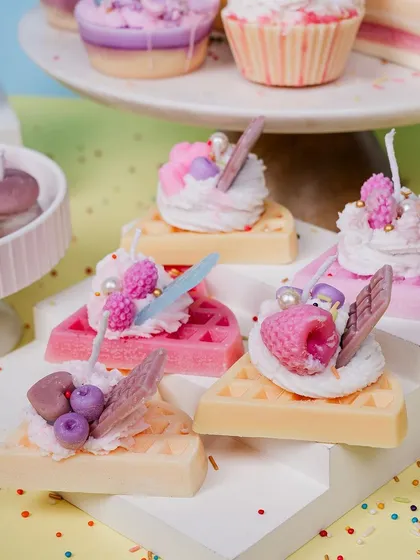 These waffle slice candles are one of my favorite creations. Each one is topped with piped whipped wax and detailed little fruit and chocolate embeds, making them a colorful and fun decorative piece for any kitchen or living space.