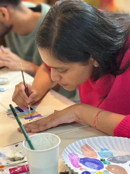 A close-up shot of a participant painting during our 'Art for Self-love' workshop. Every color and stroke has a personal meaning.