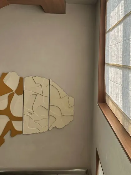 Another version of the modular artwork installed in the same Hyderabad residence, this time with a warm yellow-ochre color.