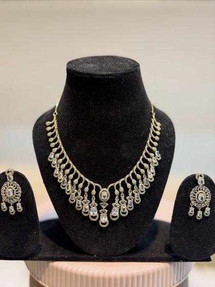 Another angle of our popular rose gold diamond set. The matching earrings feature the same intricate design as the central part of the necklace.