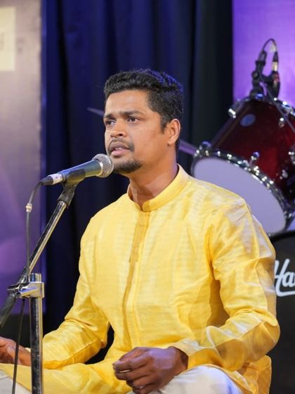 A candid shot of student Hari Kishan K during the devotional performance.