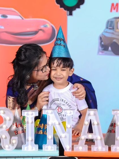 A charming 'Baby Boss' themed birthday party, with a sophisticated black and white color scheme, custom props, and a stylish backdrop, perfect for a little executive.