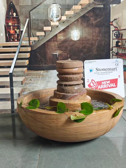 The stone lotus pond fountain, with its wide bowl, is perfect for keeping small fish or growing aquatic plants like lotus.