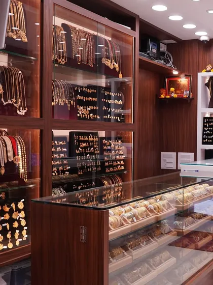 Another angle of our store's interior, showcasing the wide variety of necklaces and earrings we have in stock. We invite you to come in and explore everything we have to offer.