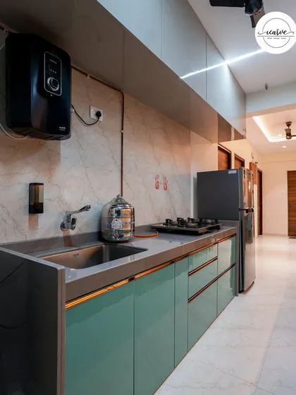 The other side of the galley kitchen, featuring the sink, water purifier, and additional counter space.