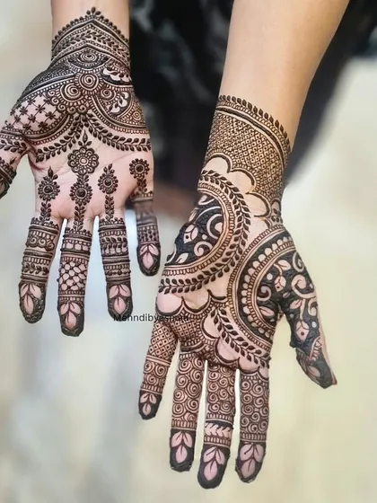 A beautiful example of asymmetrical design, where each hand has a unique pattern that complements the other.