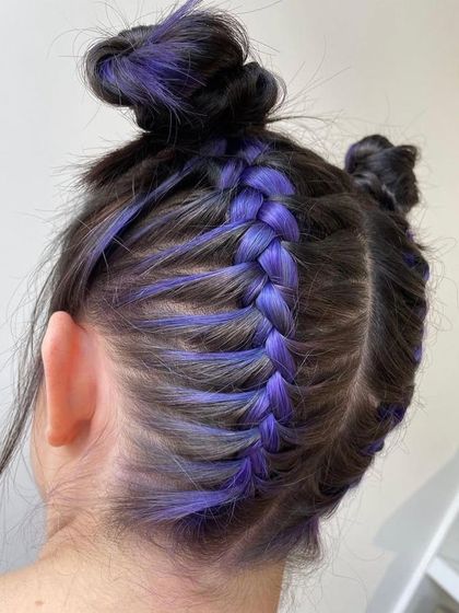 This is what I call Peekaboo Hair, a great choice for clients who want a secret pop of color. Here, vibrant purple strands are placed underneath the top layer, ready to be revealed.