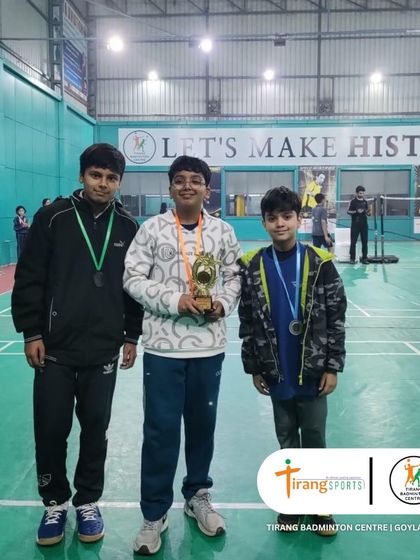 The podium finishers of a boys' category, celebrating their achievement.