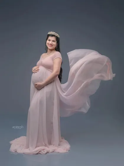 A soft pink gown with a flowing train is a classic and feminine choice. I add a gentle wind effect to the fabric to create a sense of movement and grace.