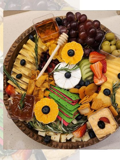 Our cheese platters are a blend of gourmet, gorgeous, and irresistible. This one features a variety of cheeses, fresh fruits, crackers, nuts, and a drizzle of honey for the perfect balance of sweet and savory.