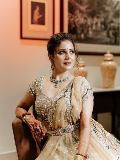 The bride's radiant look, a perfect blend of traditional jewellery and modern styling for her Sangeet night.