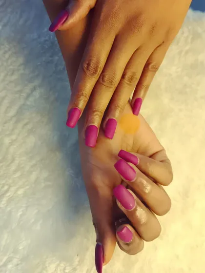 These gorgeous matte purple nails are so chic. The matte top coat gives the color a modern, velvety finish.
