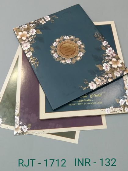 This invitation set is available in multiple colors, all featuring a classic floral border. The design is versatile and can be customized to fit your wedding's color scheme.