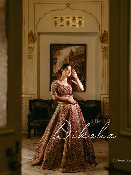A regal bridal portrait, with the bride looking elegant in the royal interiors of the Laxmi Niwas Palace, Bikaner.