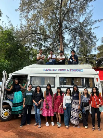 A fun group photo with some travelers on top of our trusty traveller van.