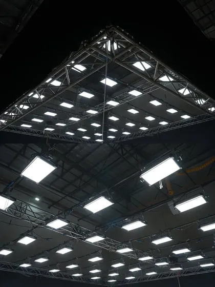 A wide view of a massive lighting rig featuring over 50 Creamsource Vortex8 panels for a Mahindra commercial. This setup provided a huge, soft top light source.