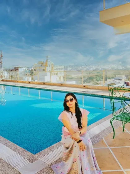 Enjoying the beautiful poolside view at a hotel in Udaipur. Traveling for work allows me to explore stunning locations, which in turn inspires me to create even more beautiful events for my clients.