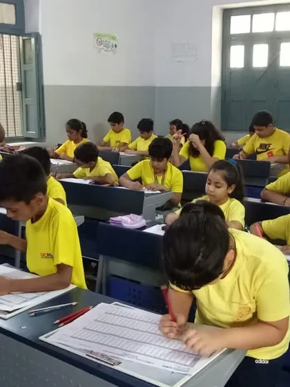 The focus in the room is palpable as students tackle 200 questions in just 8 minutes during the state-level competition.