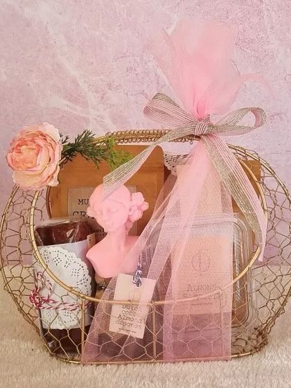 A beautiful wireframe basket in a lovely golden hue, filled with our handmade treats and wrapped in pink tulle. A perfect gift for her.