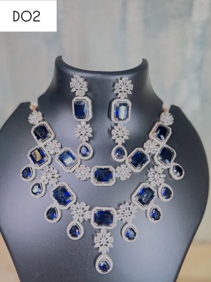 A full view of the layered sapphire blue stone necklace set. Renting this piece gives you a celebrity-inspired look, perfect for making an entrance at a cocktail party or reception.
