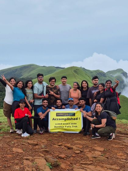 Accomplished. Our group holding the banner high after completing the Bandaje Falls trek.