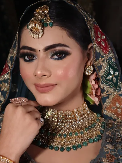 A close-up of the bridal makeup, featuring a dark smokey eye and a perfectly blended base.