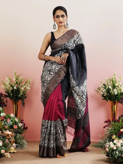 The full view of the graphic print saree with faces and pink accents, a unique and modern design.