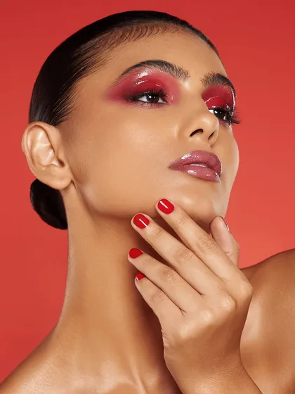A glossy red eye and lip combination that is bold, modern, and incredibly chic. A standout look from our Bangalore students.