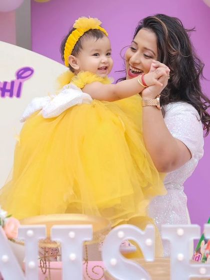 A magical 'Princess' themed birthday party, with elegant decor, shimmering backdrops, and royal props, making every little girl feel like royalty.