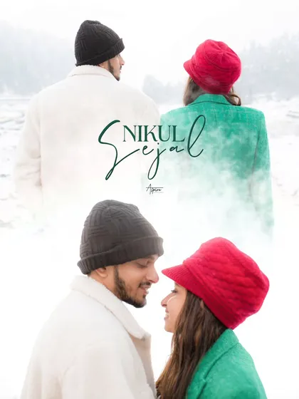 A creative and artistic portrait of Nikul and Sejal in the snow. The contrast between their colorful beanies and the white landscape, combined with their close gaze, makes for a striking and memorable image.