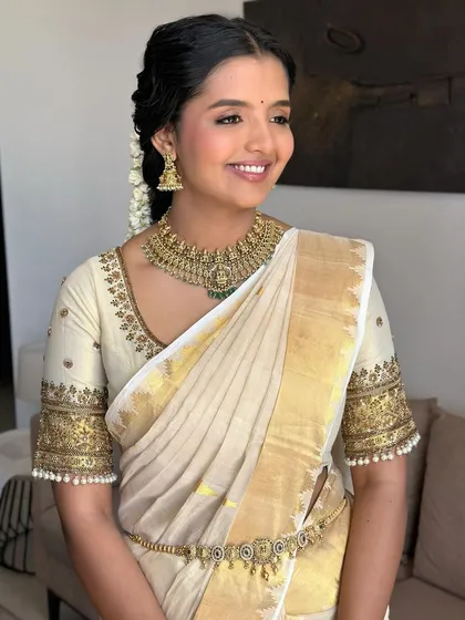 A happy, glowing South Indian bride. This look is a full cultural serve with a side of sass, blending tradition with my signature glam.