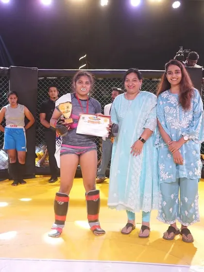 Heena's hand raised in victory at the Beach Fight Night. A proud moment for her and for the entire FCC team.