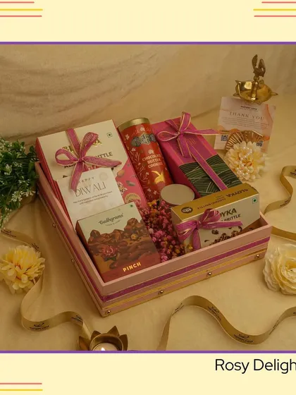 Another look at the 'Rosy Delight' hamper, showcasing its beautiful arrangement of festive treats in a striped pink tray.