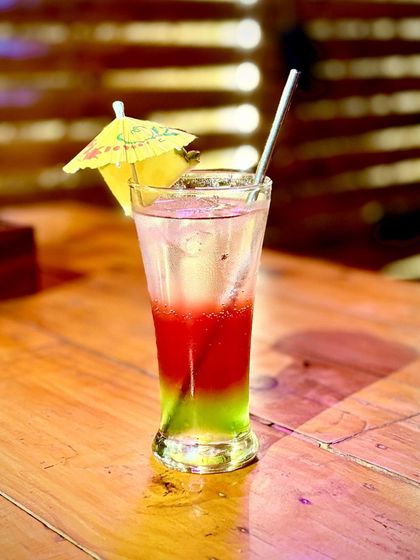 A vibrant, layered mocktail that tastes as good as it looks.