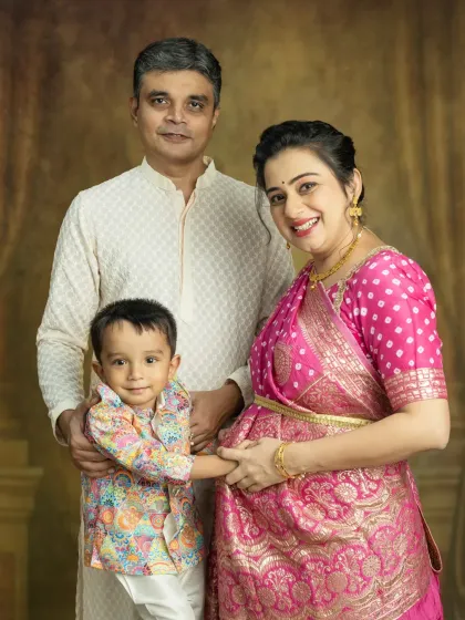Your first child is just as excited to meet the new baby. This family portrait is full of love, with his little hand on your bump, connecting with his new sibling.