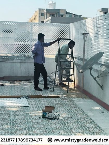 Our team at work installing the PVC lattice privacy screen on a terrace. We ensure every panel is perfectly aligned for a professional and secure finish.