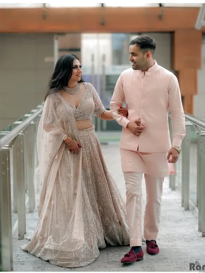 A candid shot of the newly engaged couple walking and sharing a laugh. Capturing these unposed, happy moments is key to telling the real story of your celebration.