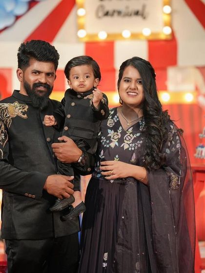 A beautiful family portrait from Dhiren's carnival-themed first birthday celebration.