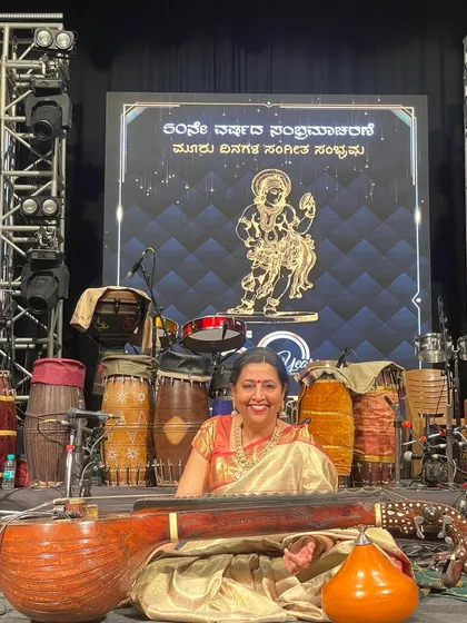 This is me, ready for a concert and completely in my element. I love the energy of a live audience and the moments right before the music begins, with my veena in hand, on a beautifully lit stage.