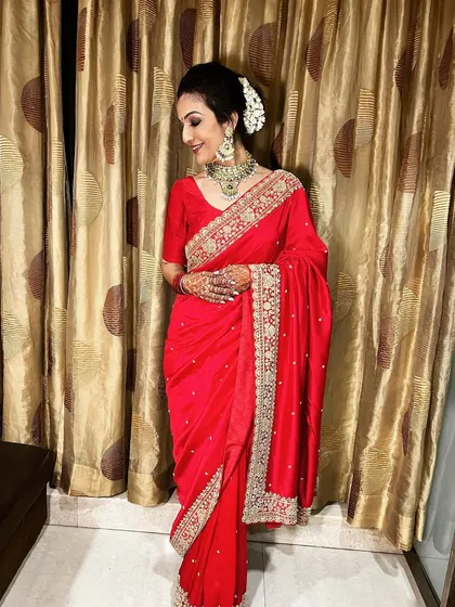 The full look, showing how a traditional gajra bun completes the festive ensemble perfectly.