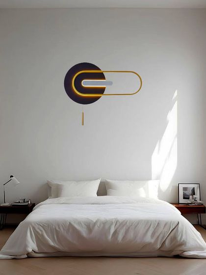 This ultra-modern, sculptural wall light acts as a piece of abstract art. Placed above the bed, it blends beauty and brilliance, providing a soft, indirect glow perfect for a minimalist bedroom.