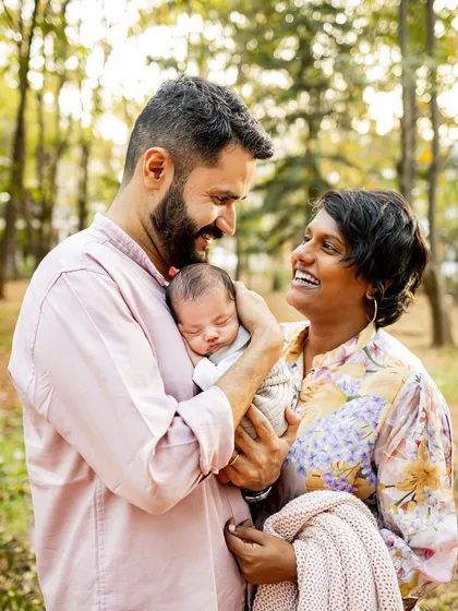The pure joy and laughter between new parents as they admire their sleeping baby. My lifestyle approach focuses on capturing these candid, emotional moments that truly define your family's story.
