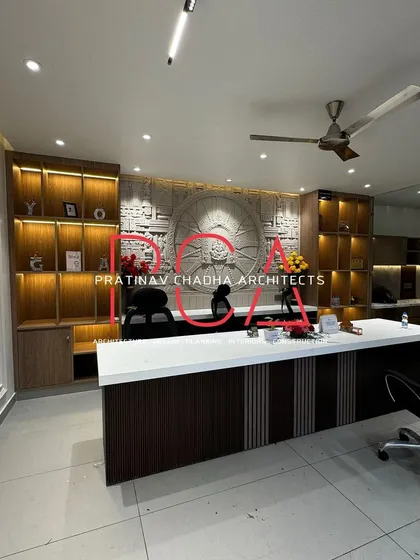 For the Hari Mandir office, the design brief was to create a space that felt both professional and divine. The centerpiece is a magnificent CNC-carved mural inspired by the Konark Sun Temple, flanked by backlit shelving to create a tranquil and inspiring administrative environment.