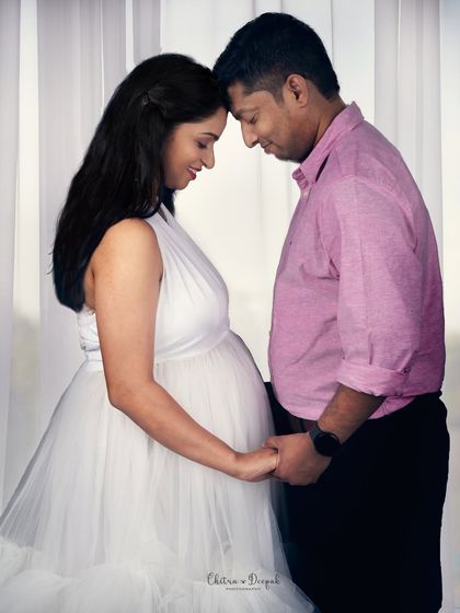 A tender forehead-to-forehead pose that speaks volumes about their bond. The soft backlighting adds a dreamy, romantic feel to the portrait.