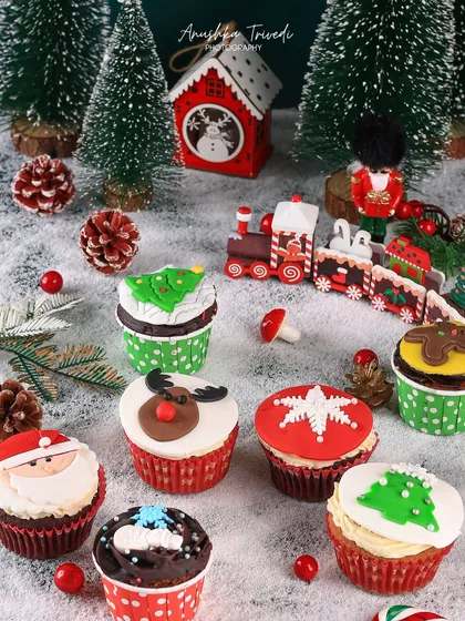A close-up of the adorable Christmas-themed cupcake toppers, from Santa and reindeers to snowflakes. These details are what make a festive shoot special.