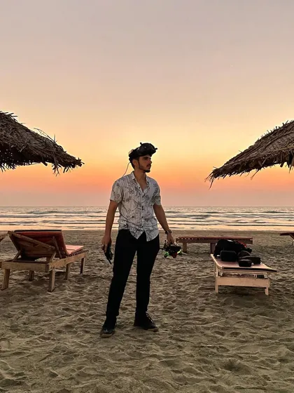 A photo from my three-year FPV journey, standing on a beach at sunset, a symbol of the beautiful places this craft has taken me.