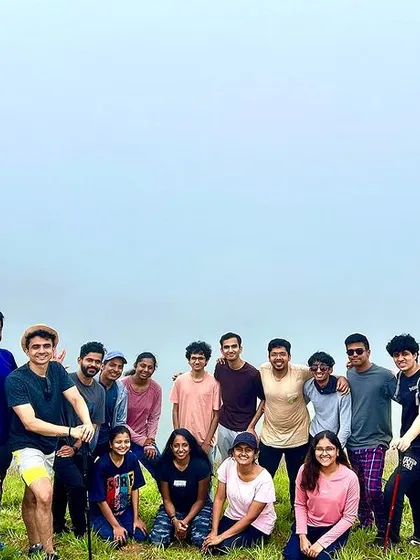 A large group in the mist, barely visible but their presence felt. This captures the mysterious and atmospheric beauty of a monsoon trek.
