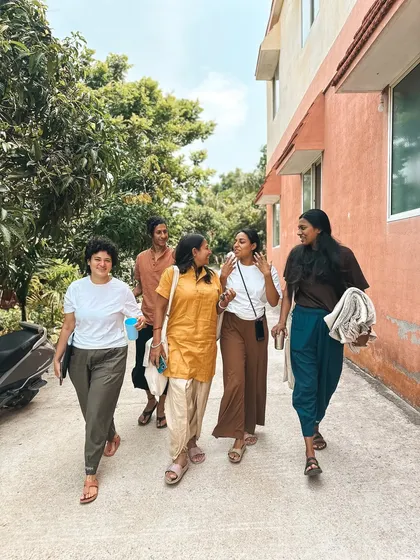Students walk and talk together on the ashram grounds. These in-between moments of conversation and shared experience are where some of the strongest bonds are formed.
